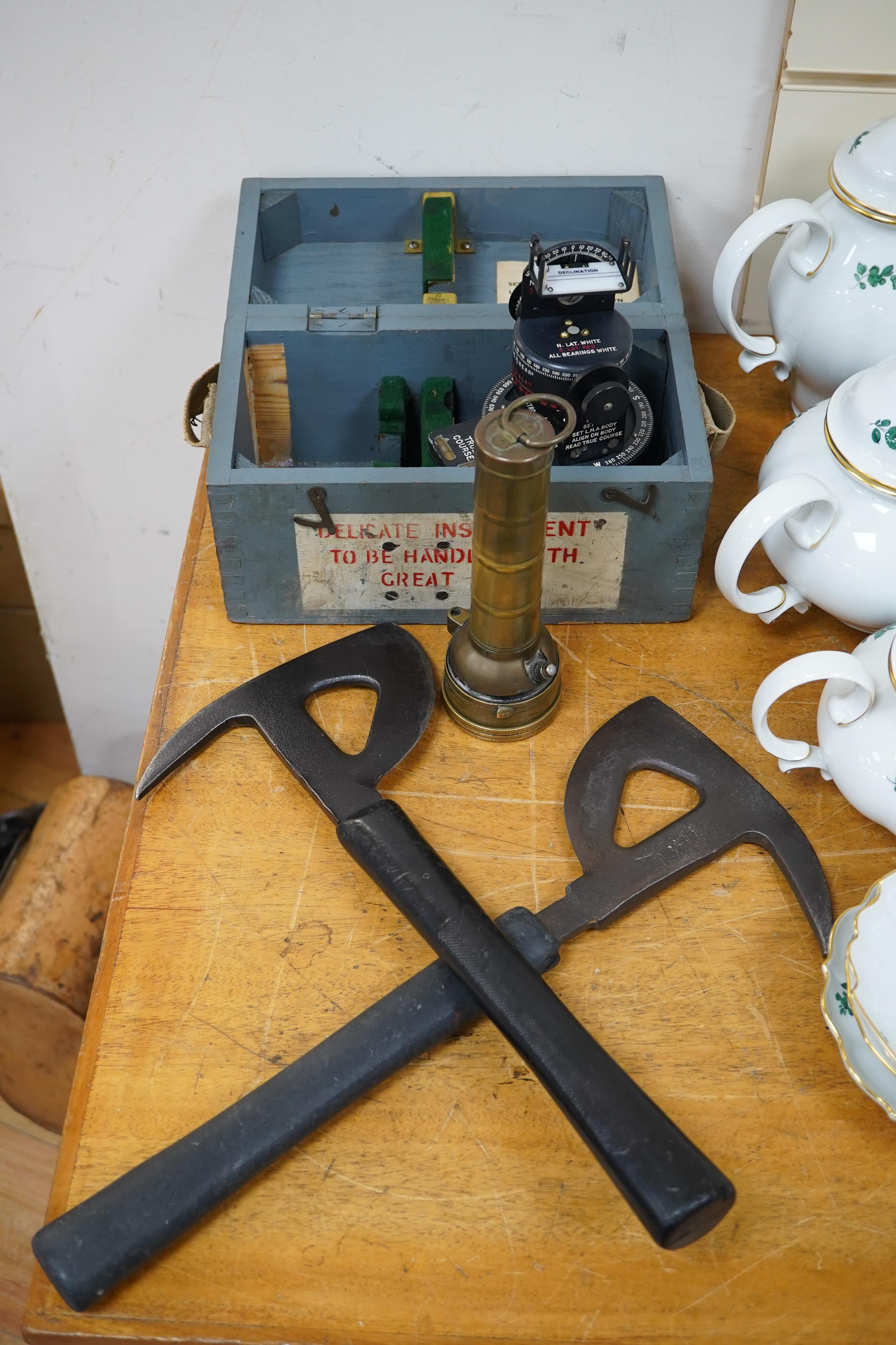 Two WWII RAF Air Ministry aircraft escape axes, one stamped; Elwell 1943, a cased Astro Compass Mk.II, and a brass Air Ministry signalling torch. Condition - fair to good.